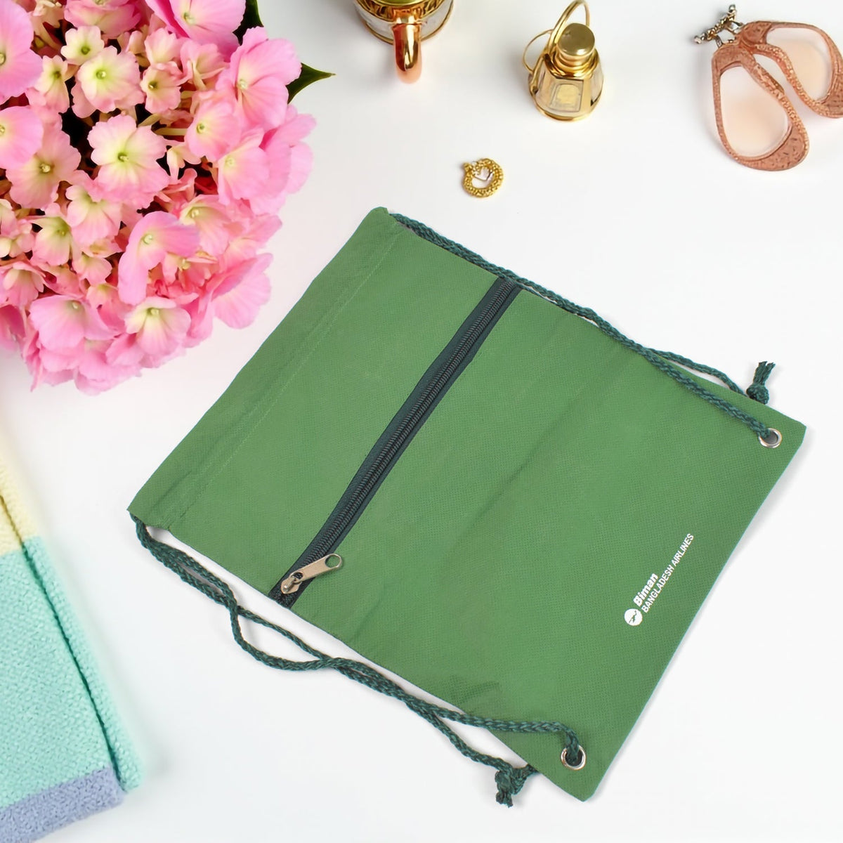 Two-piece Hajj kit including a shoulder bag and prayer mat, neatly arranged.