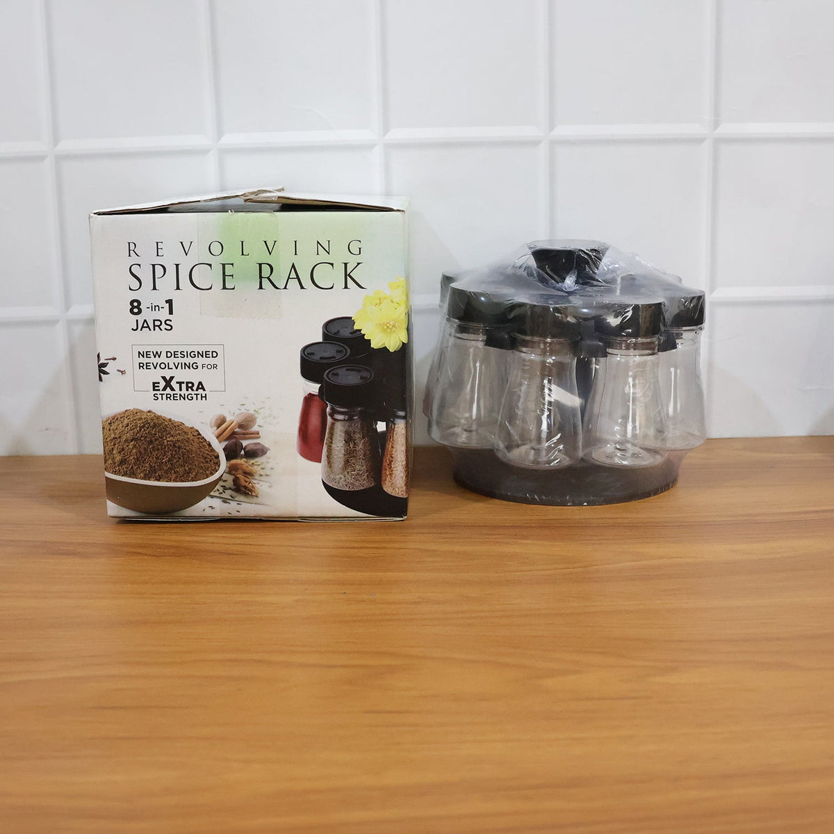Space-saving revolving spice holder featuring transparent jars for easy identification